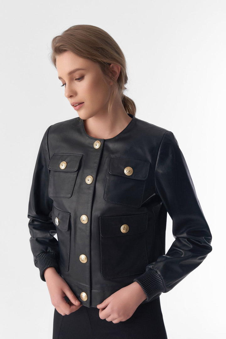 Woman wearing black leather button jacket