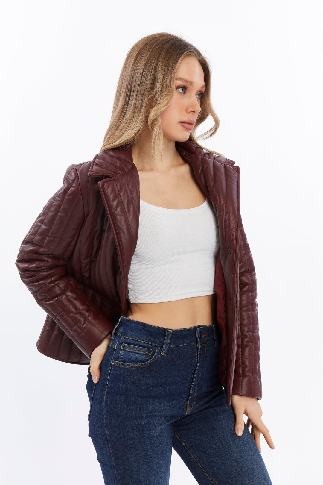 Woman wearing burgundy quilted leather coat