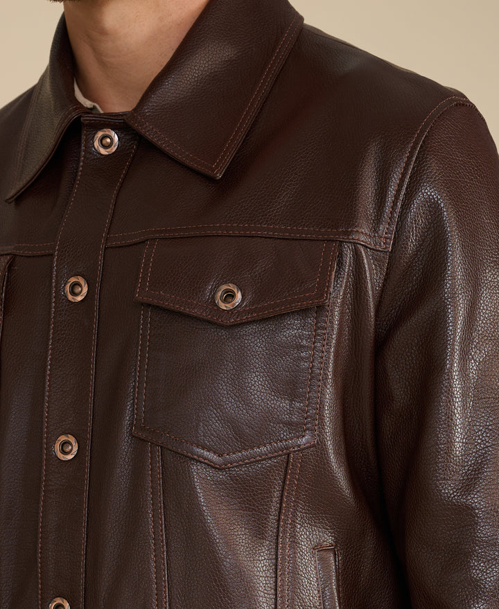Dark brown pebbled leather jacket close-up