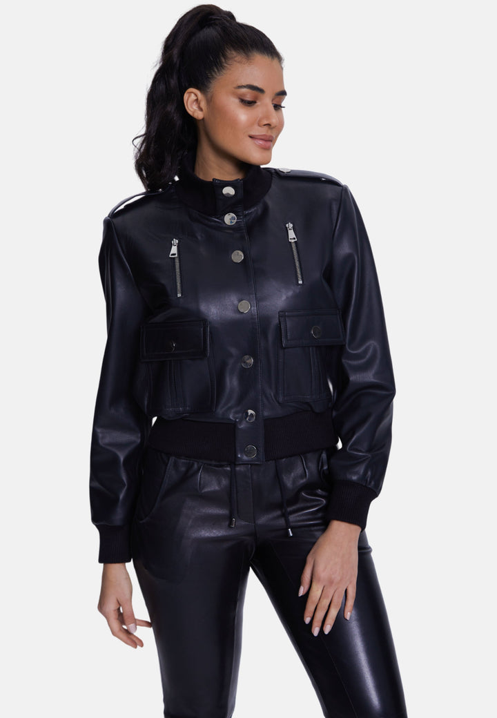 Woman wearing black faux-leather bomber jacket