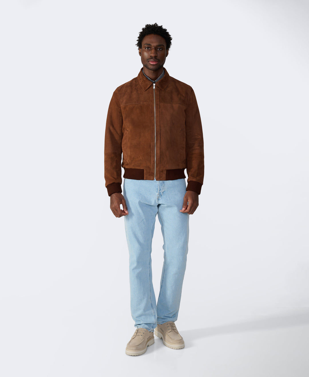 Brown suede bomber jacket on model