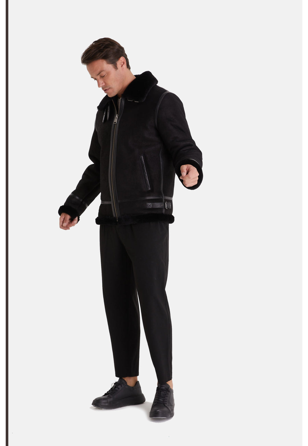 Man wearing black sheepskin aviator jacket