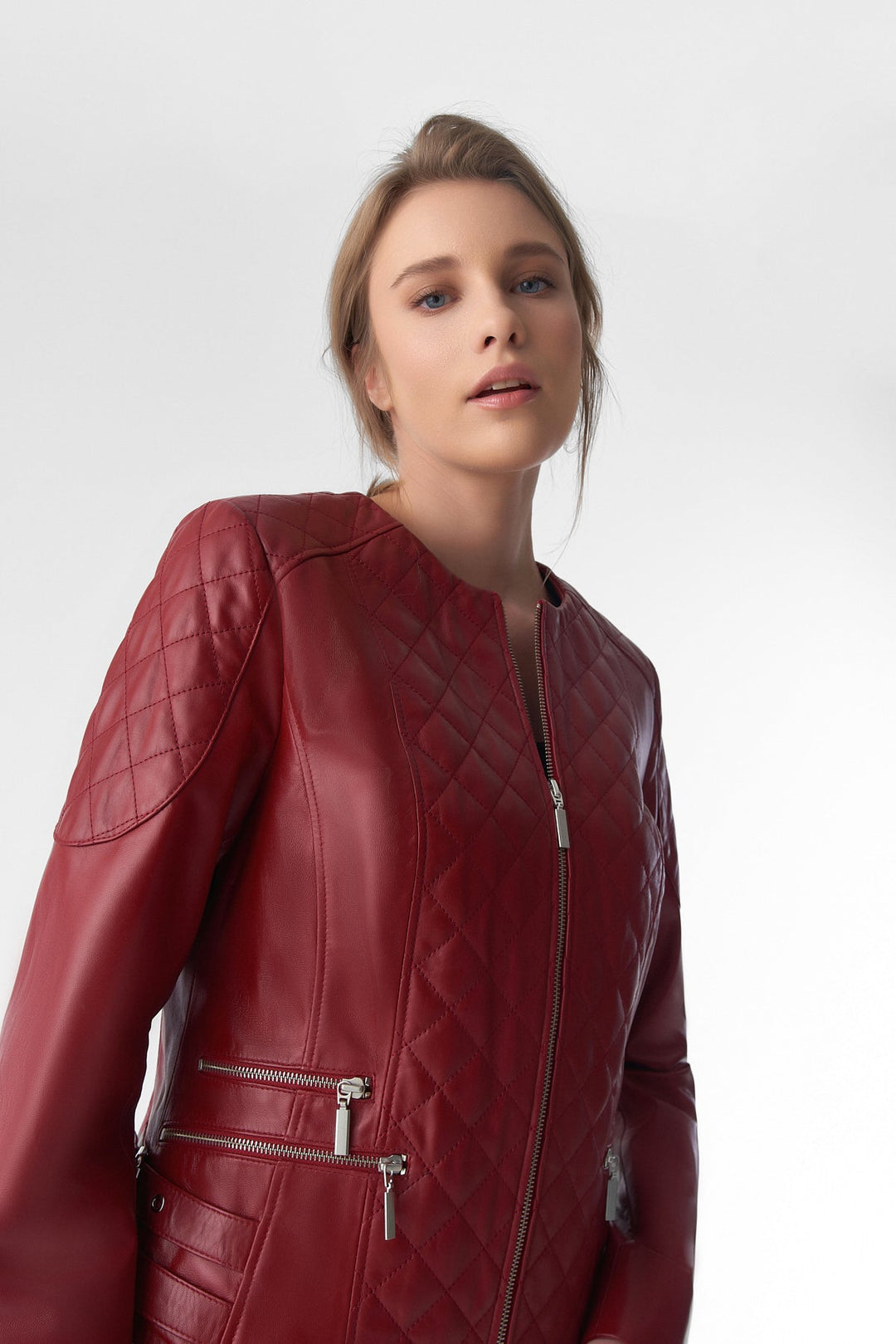 Woman wearing red quilted leather jacket