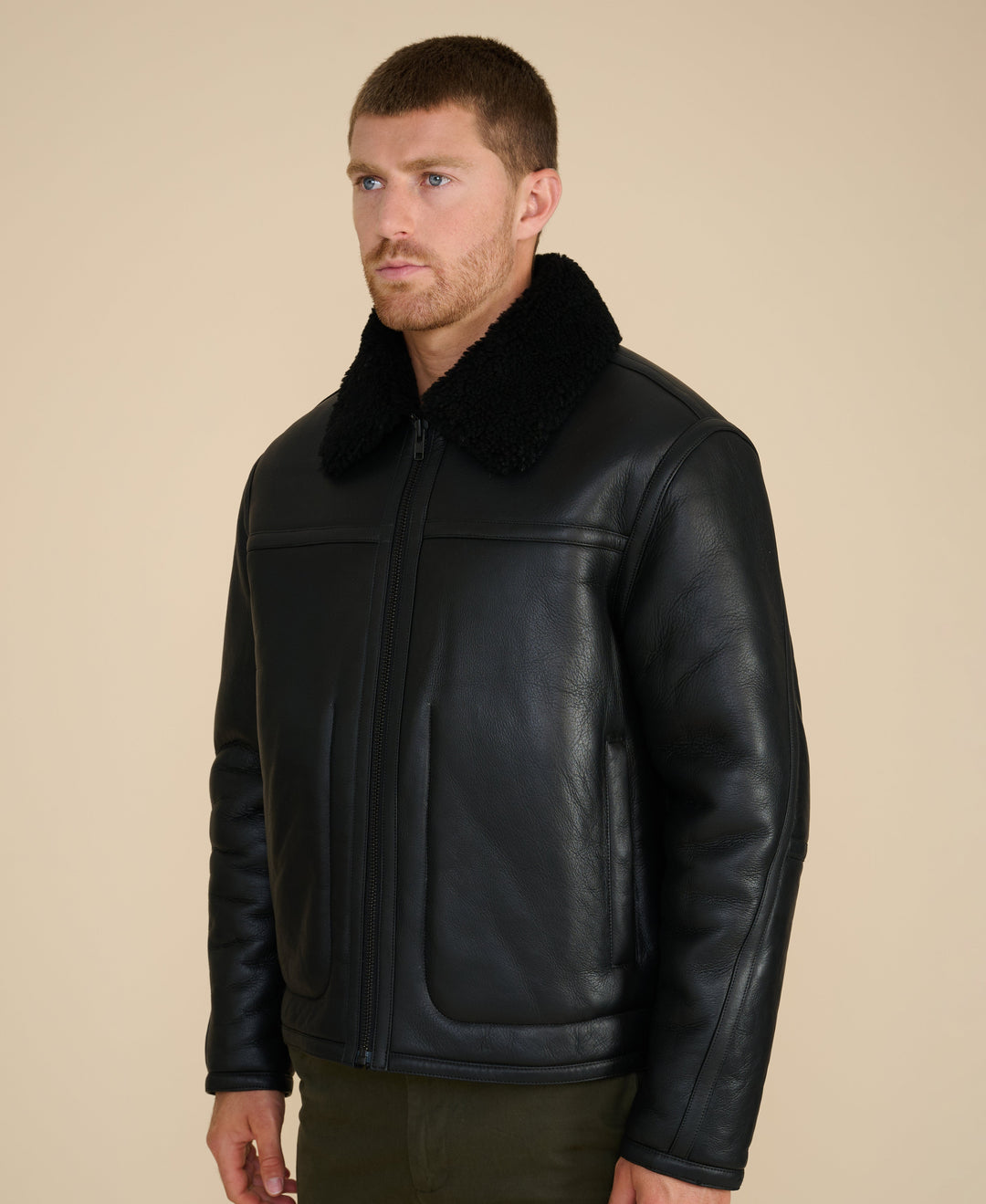 Black shearling leather jacket on model