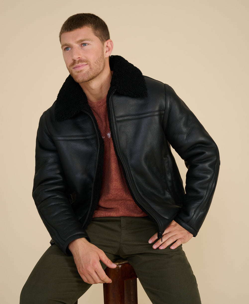 Man wearing black shearling jacket