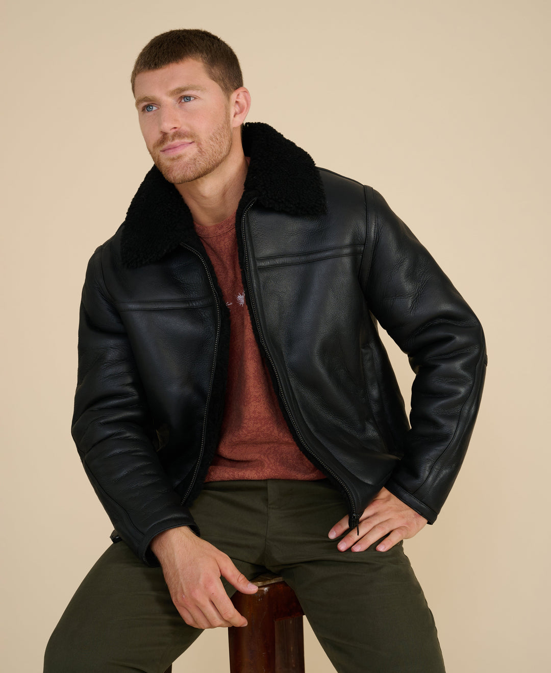 Man wearing black shearling jacket