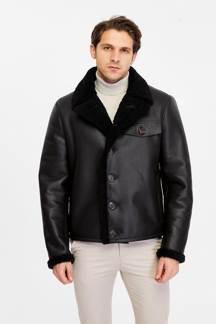 Man wearing black shearling leather jacket
