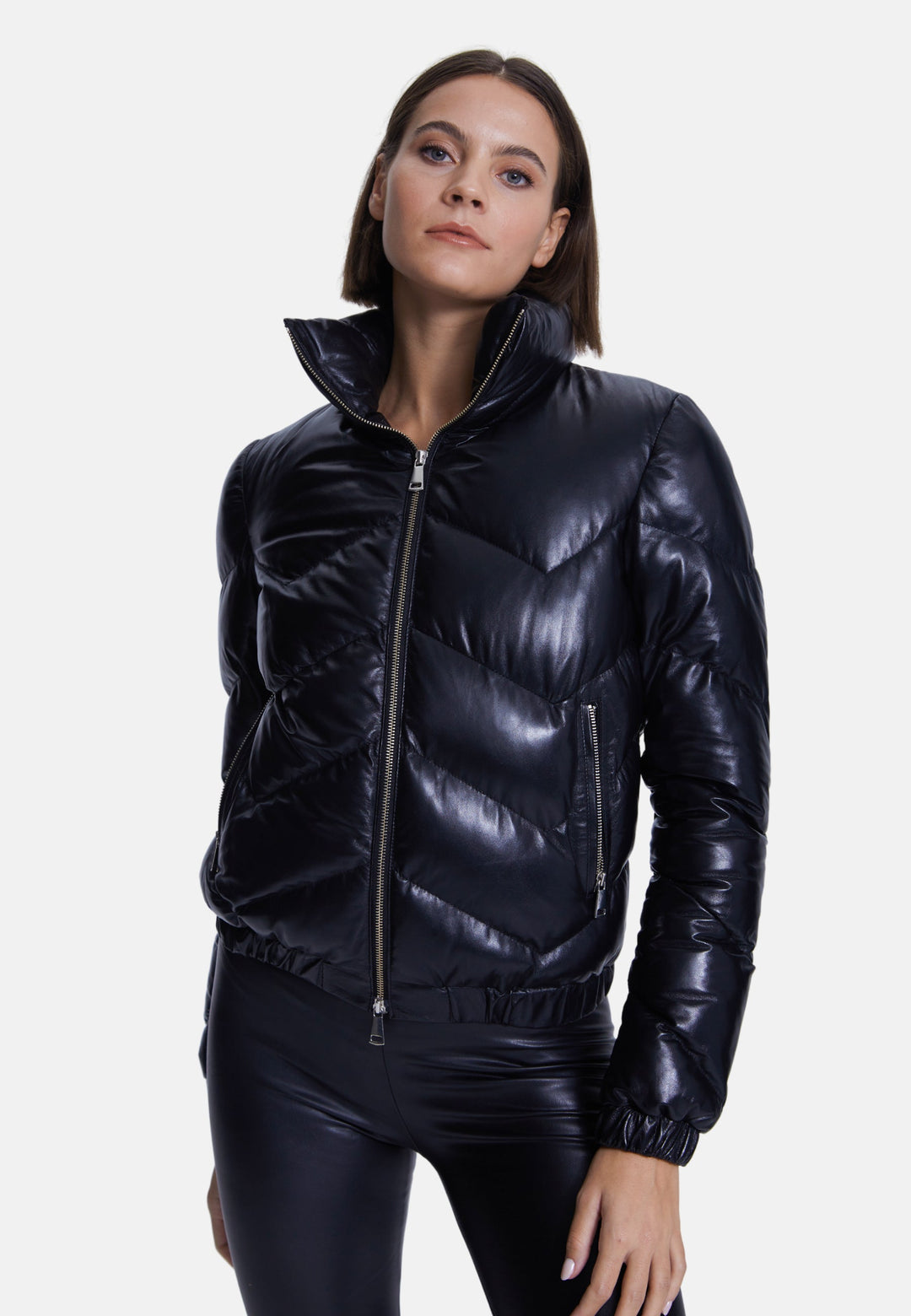 Woman wearing black glossy puffer jacket