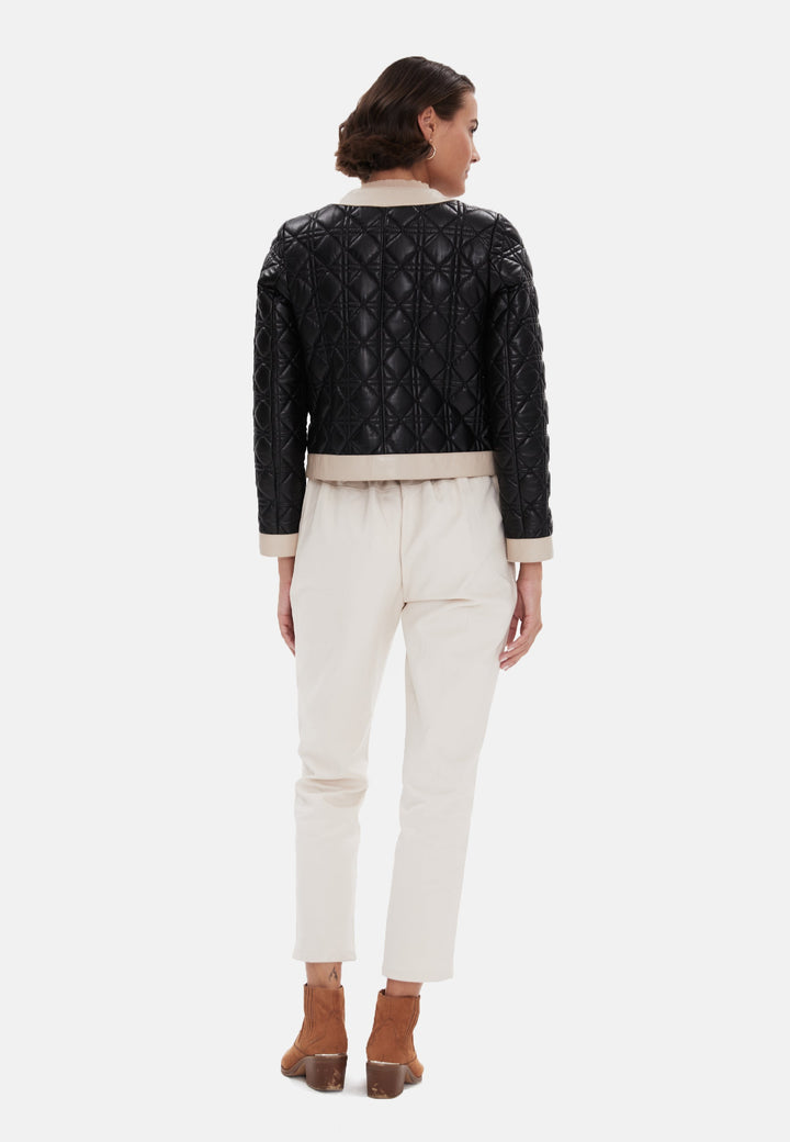 Woman wearing black quilted leather jacket