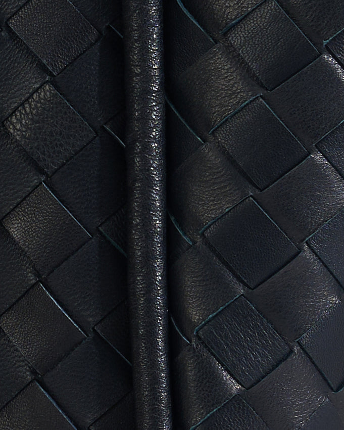 Close-up black woven leather bag