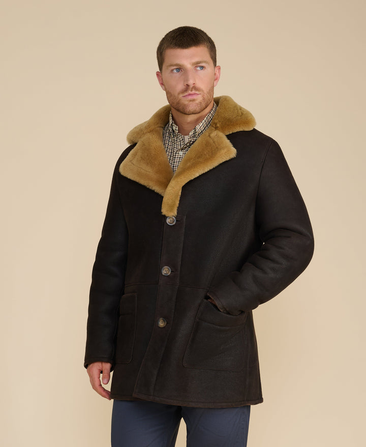 Men's black shearling coat with tan collar
