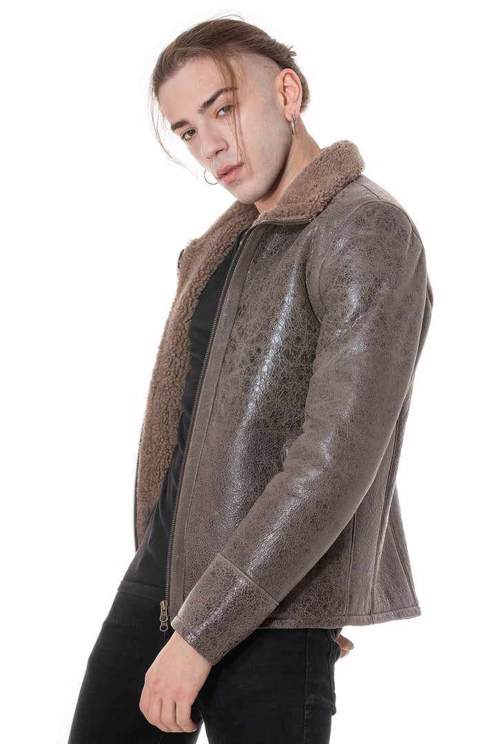 Man wearing brown sheepskin jacket