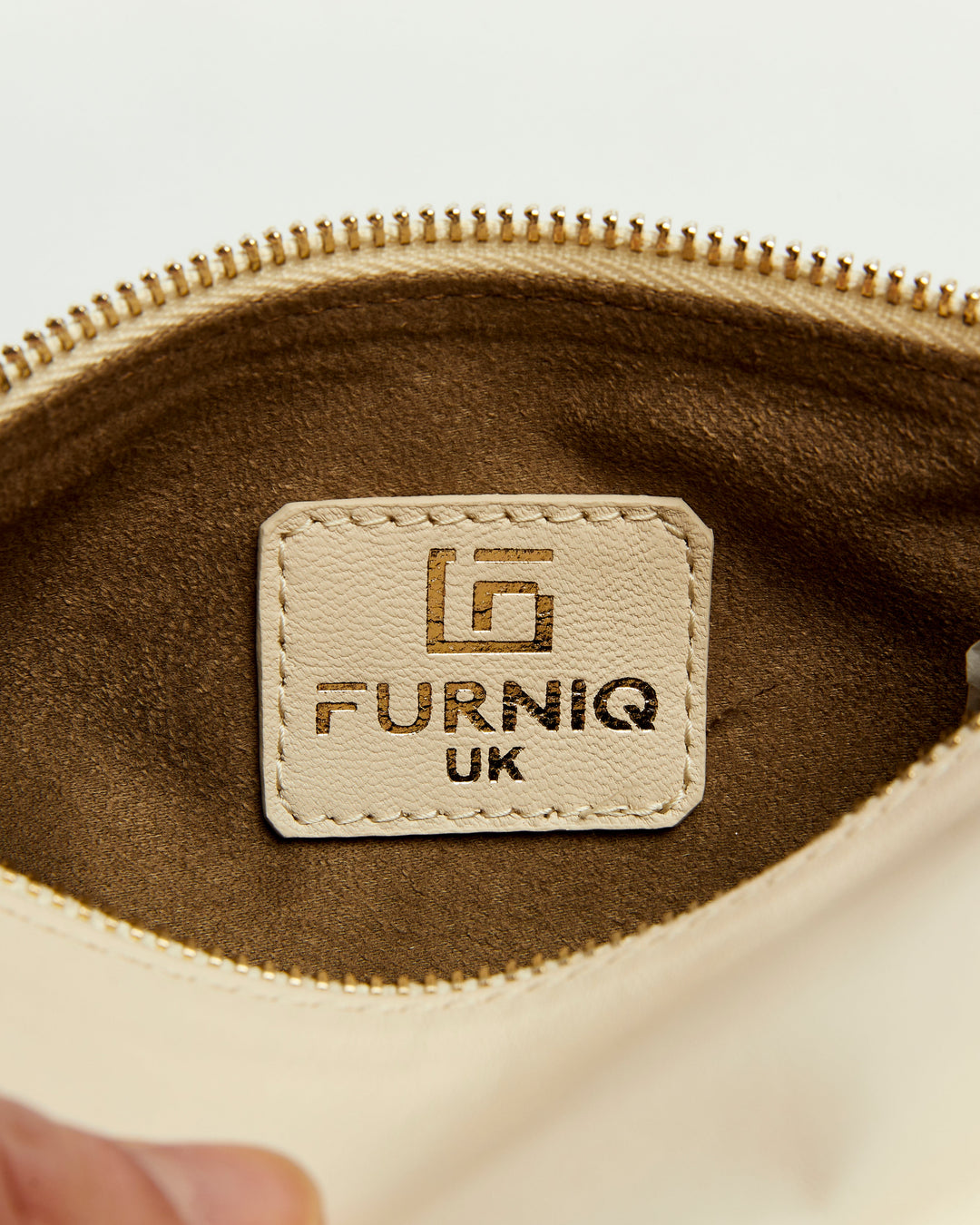 Beige leather handbag interior label