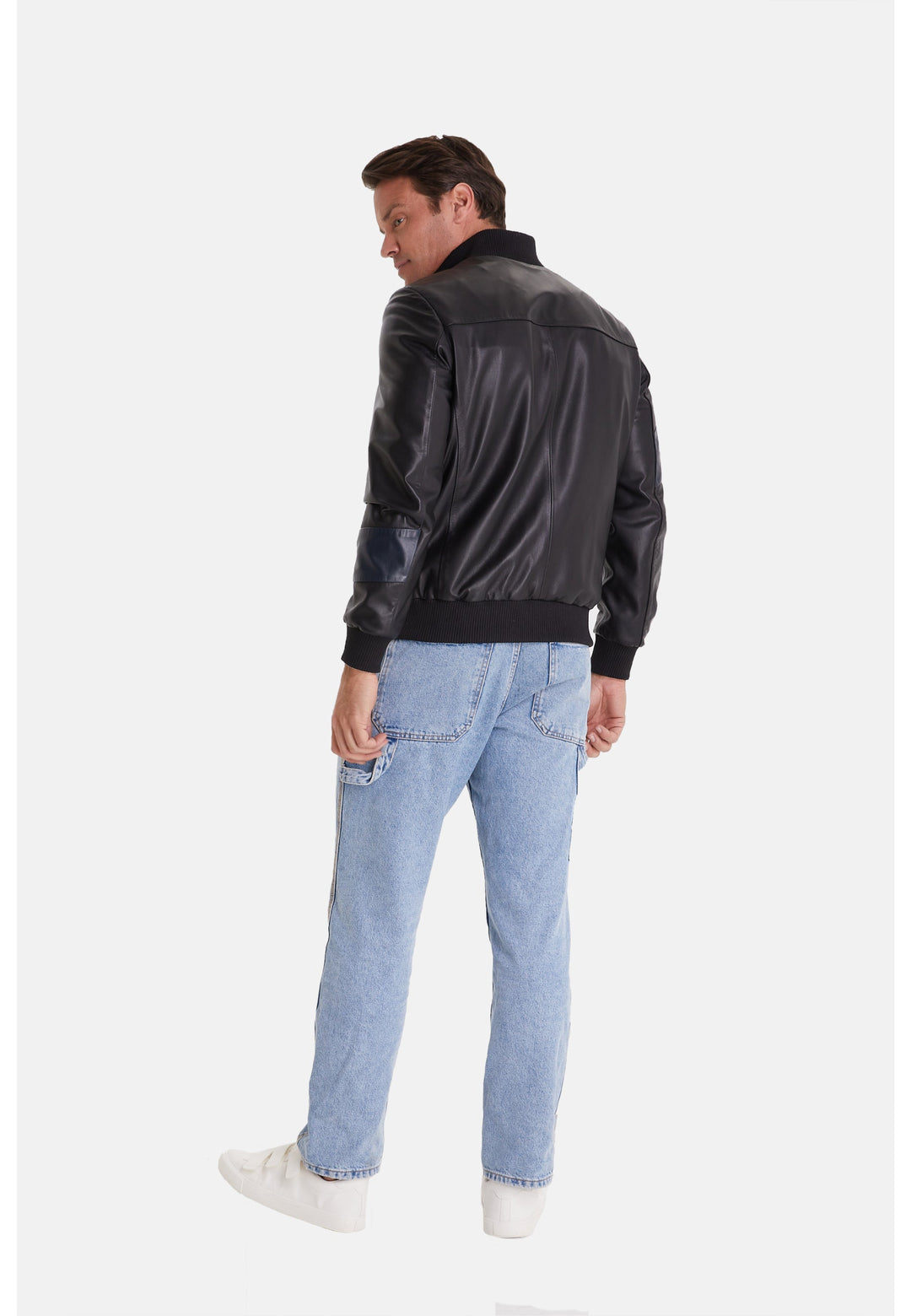 Man wearing black leather bomber jacket