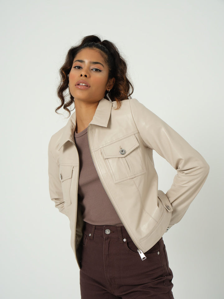 Woman wearing beige leather jacket