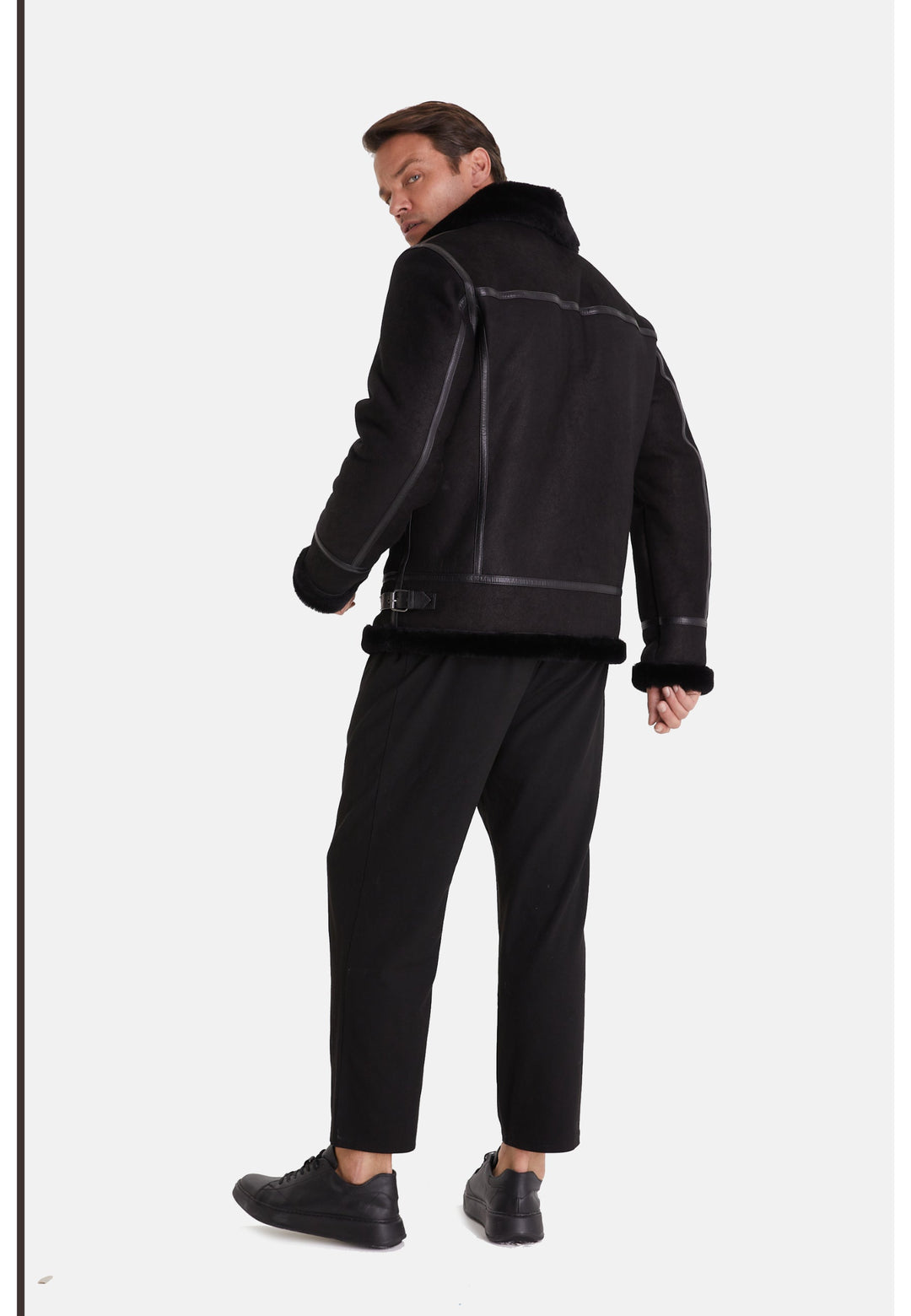 Man wearing black sheepskin aviator jacket