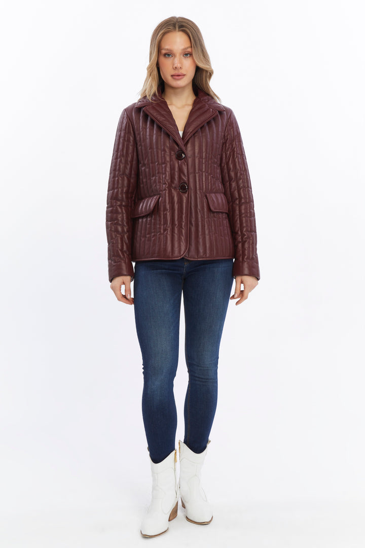 Woman wearing burgundy quilted leather coat