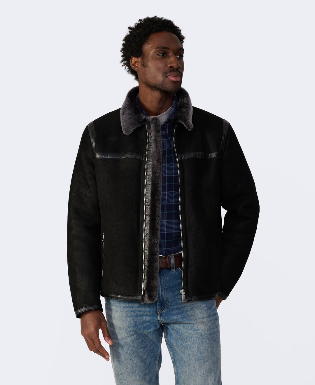 Man wearing black shearling jacket
