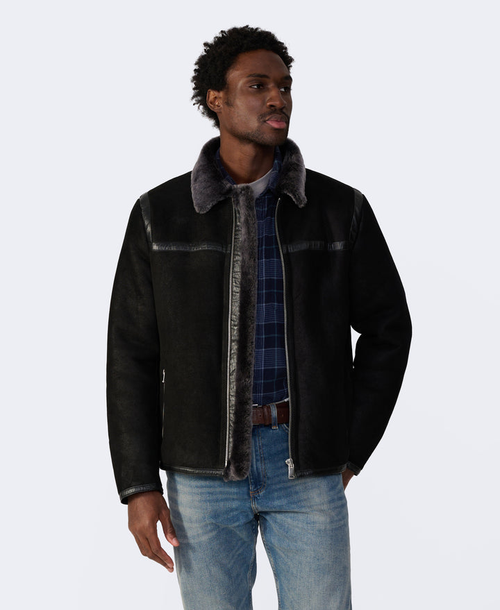 Man wearing black shearling jacket