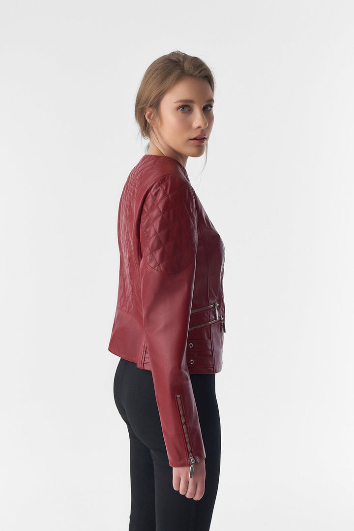 Woman in red leather jacket side view