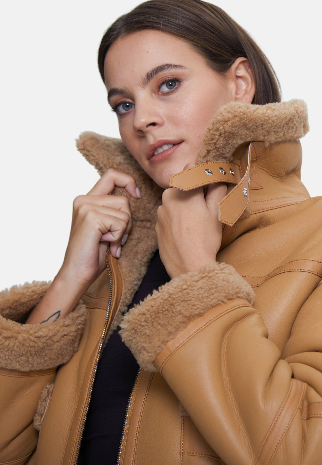Tan sheepskin jacket on model