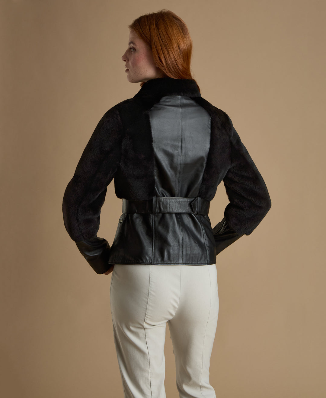 Woman wearing black leather jacket