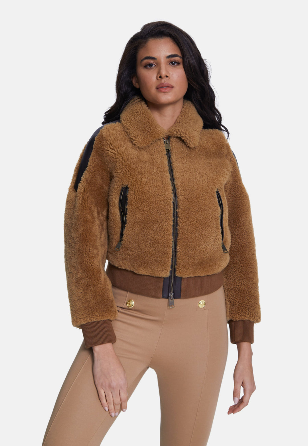 Woman wearing brown sheepskin teddy jacket