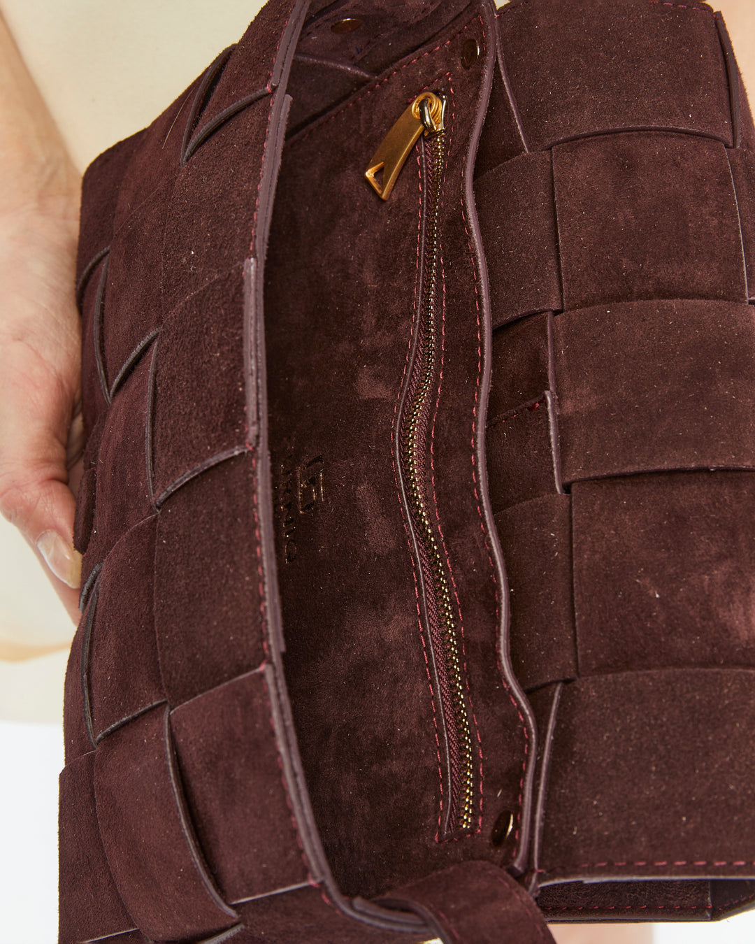 Red-brown woven suede handbag interior