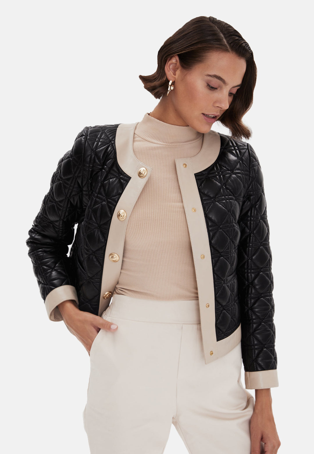 Black quilted leather jacket with beige trim