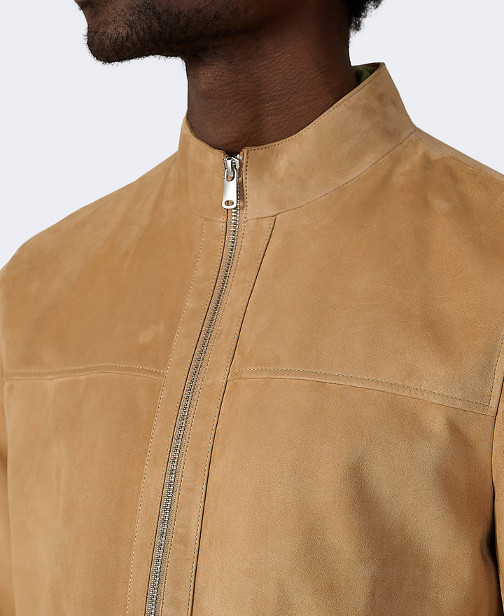Tan suede bomber jacket close-up