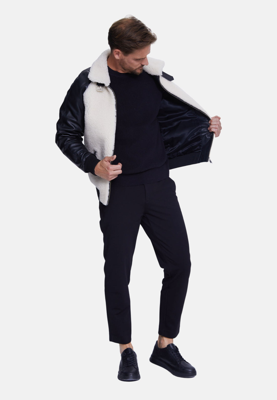 Man wearing black shearling jacket