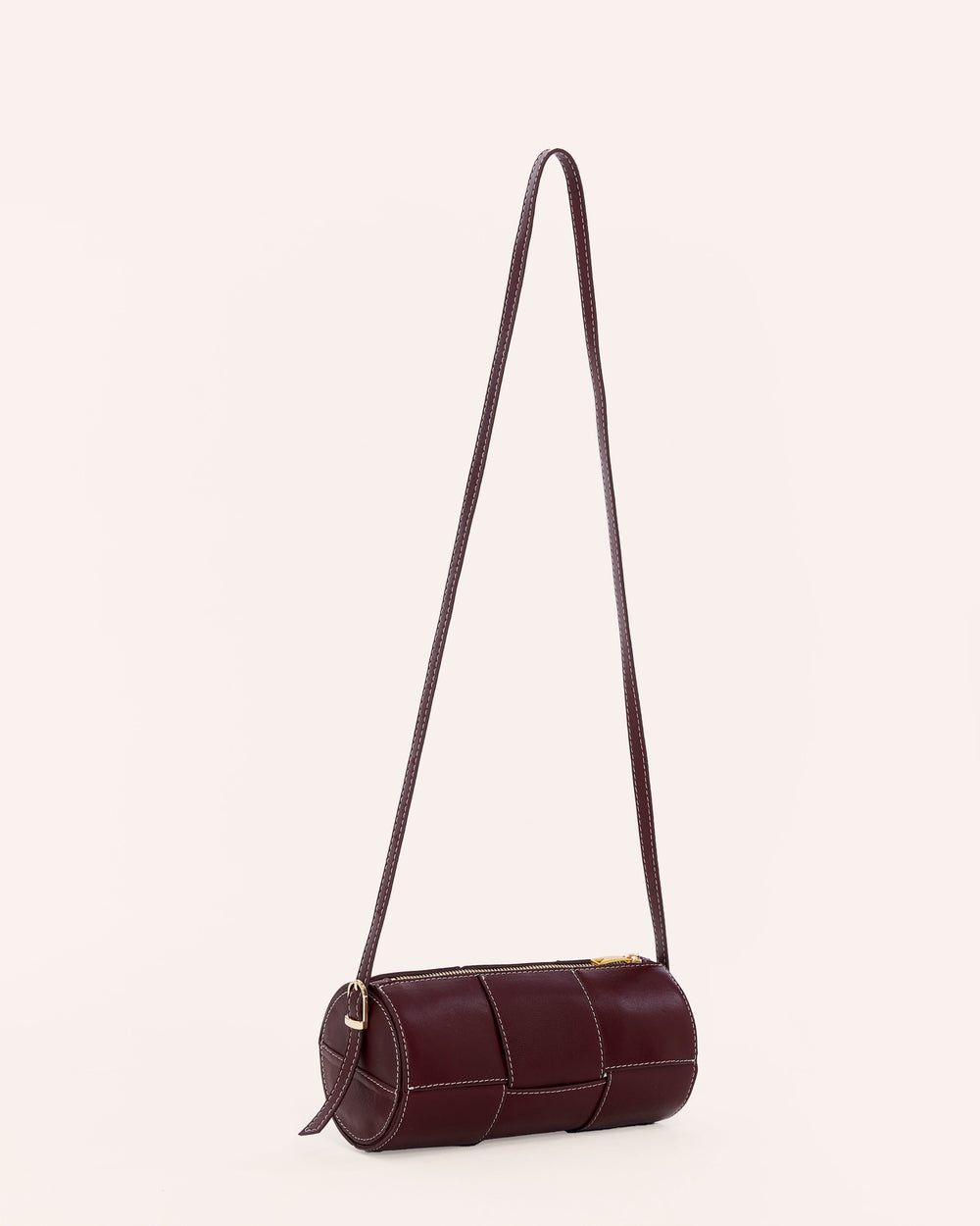 Burgundy woven leather cylinder handbag