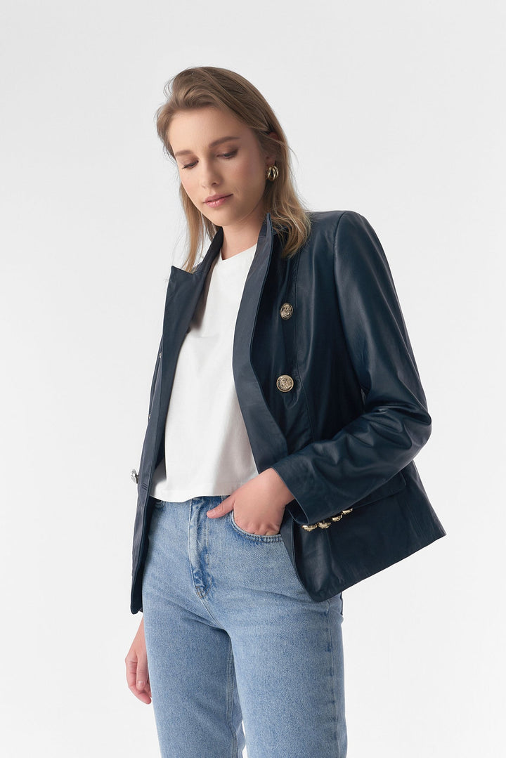 Woman wearing navy leather blazer