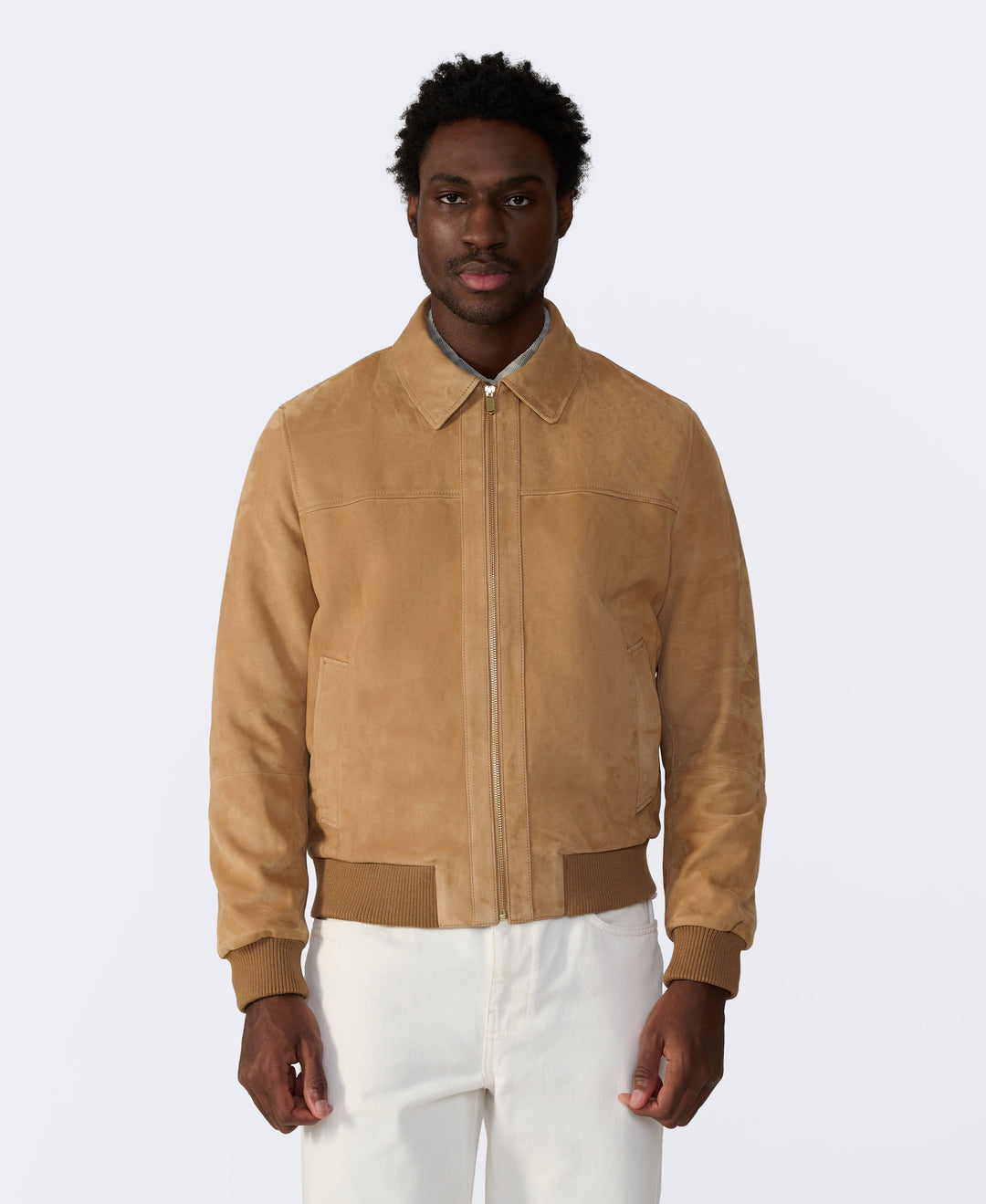 Tan suede bomber jacket on model