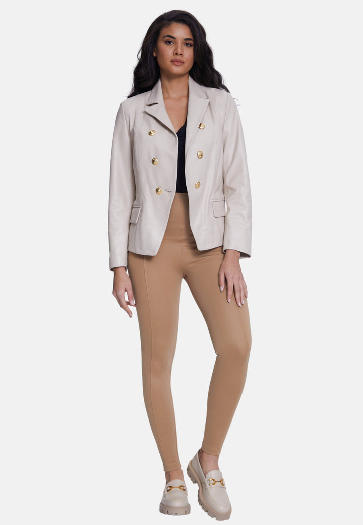 Woman wearing beige leather blazer