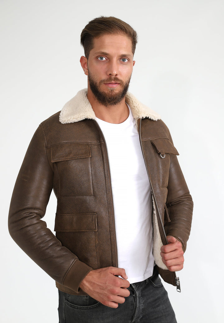Man wearing brown shearling leather jacket