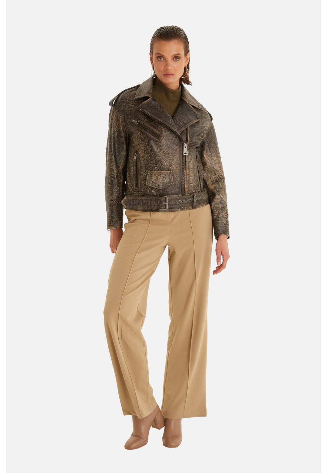 Woman wearing olive metallic leather biker