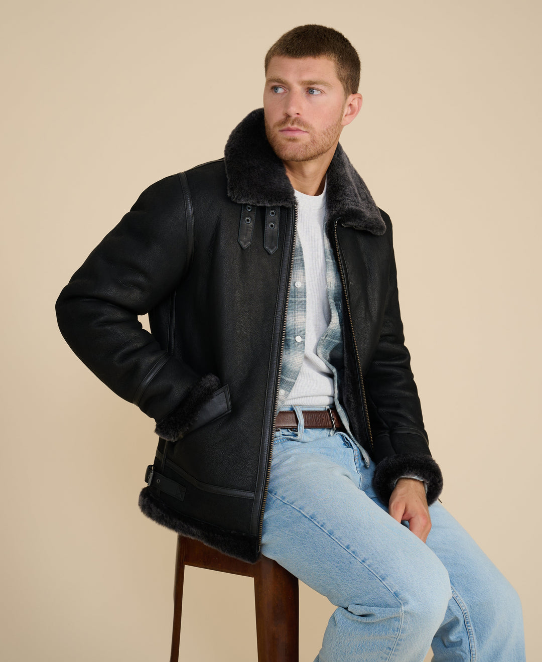 Man wearing black sheepskin aviator jacket