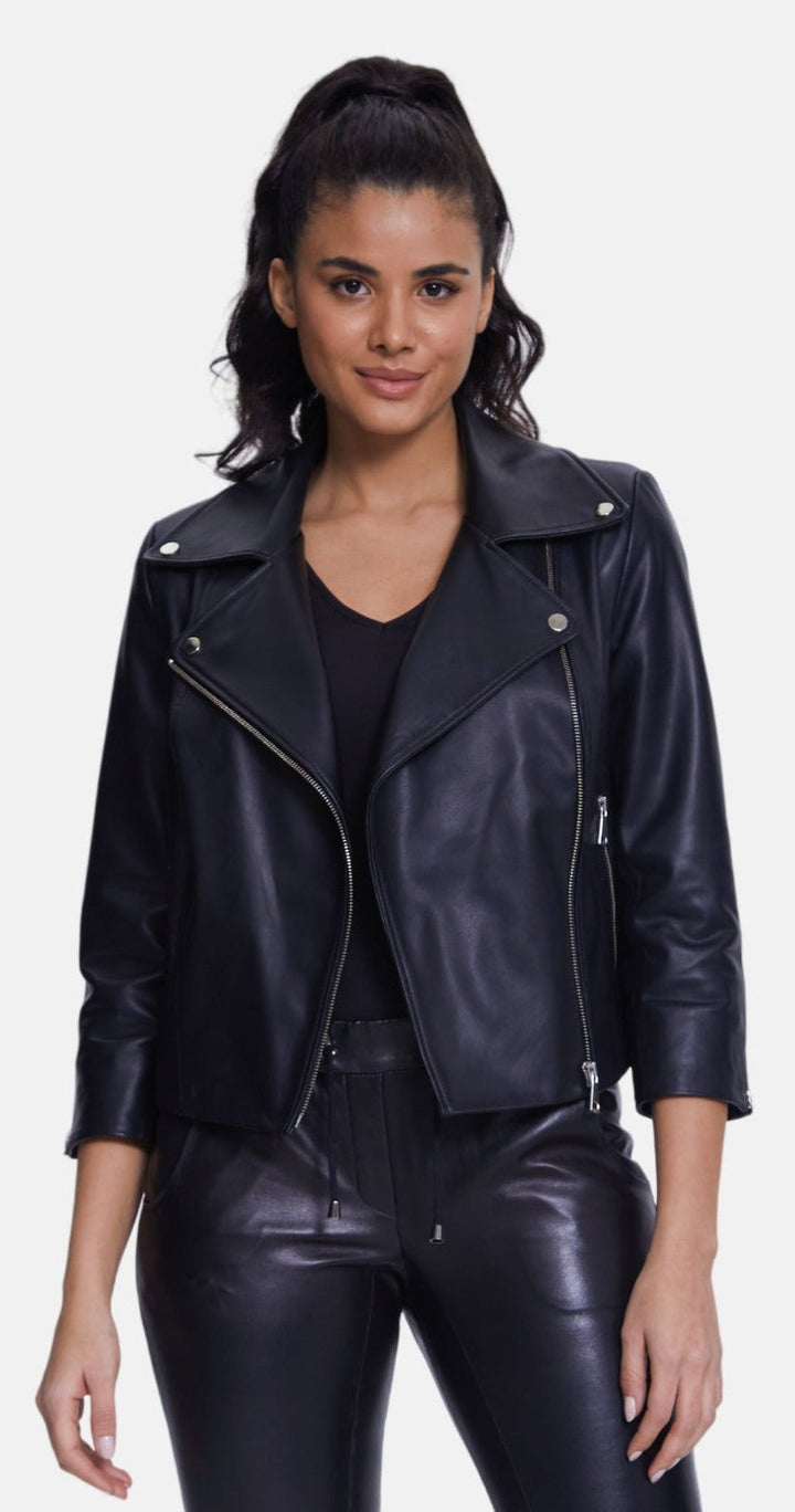 Woman wearing black leather biker jacket