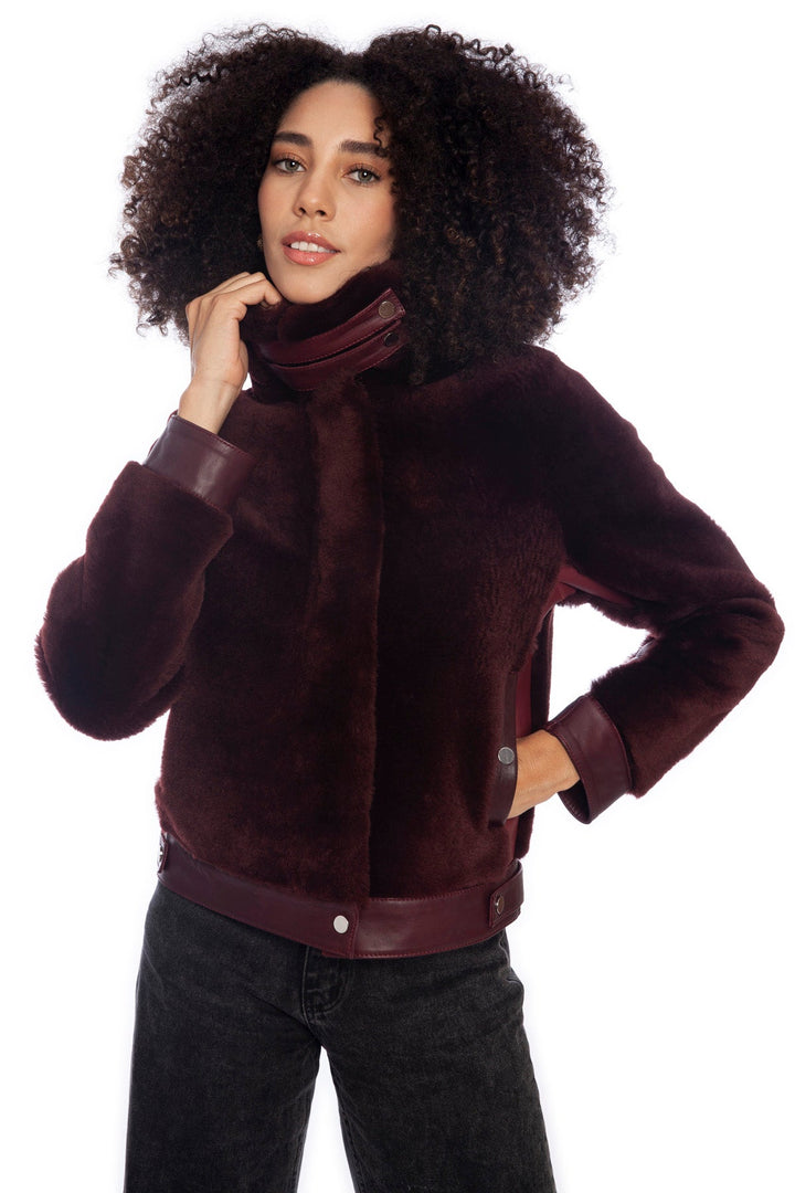 Maroon shearling jacket on female model