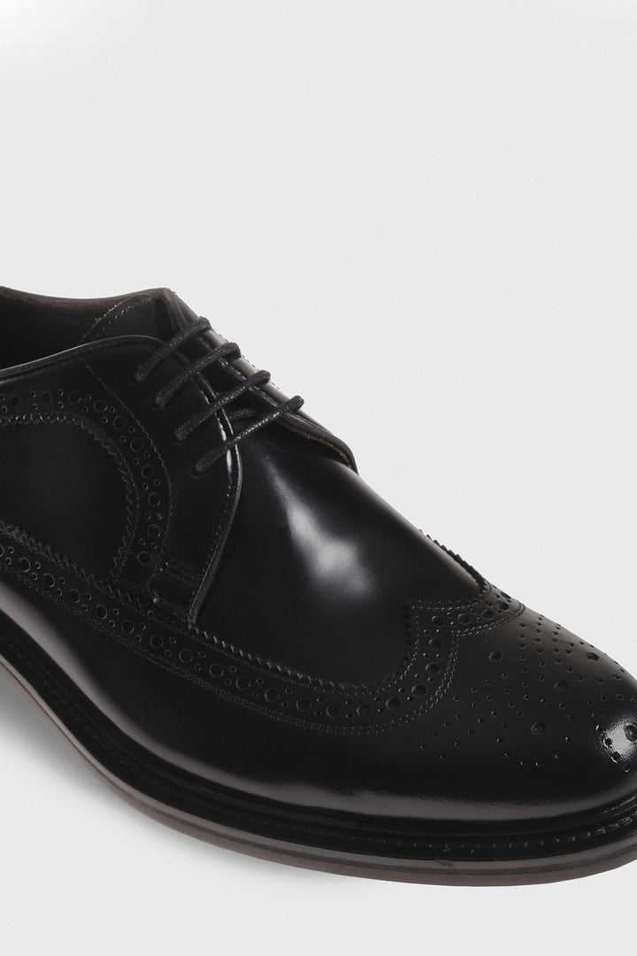 Black leather wingtip brogue shoe