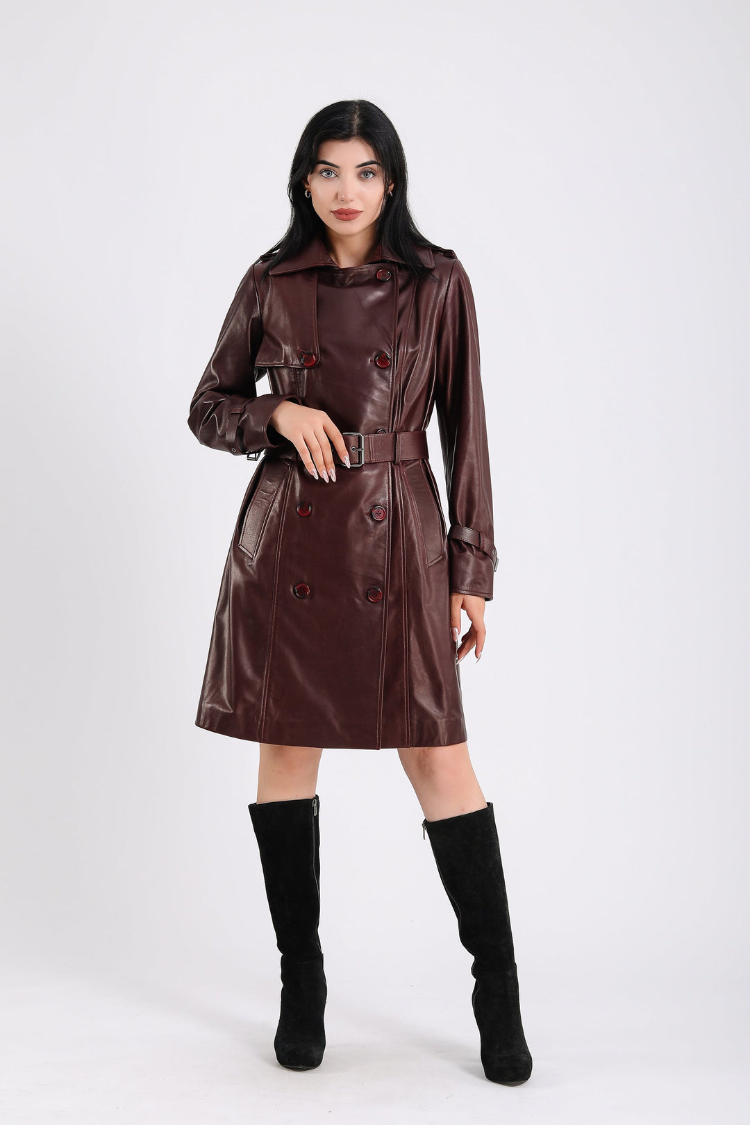 Woman wearing brown leather trench coat
