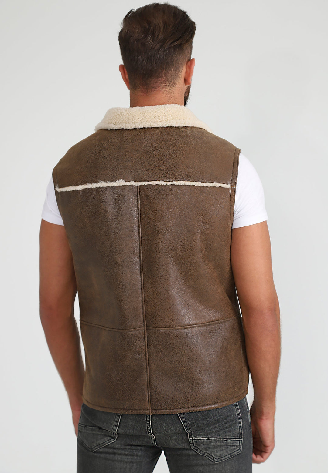 Man wearing brown sheepskin waistcoat