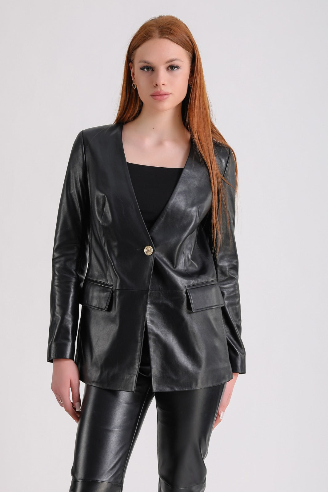 Female model wearing black leather blazer