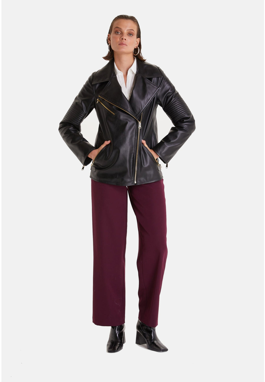 Woman wearing black leather biker jacket