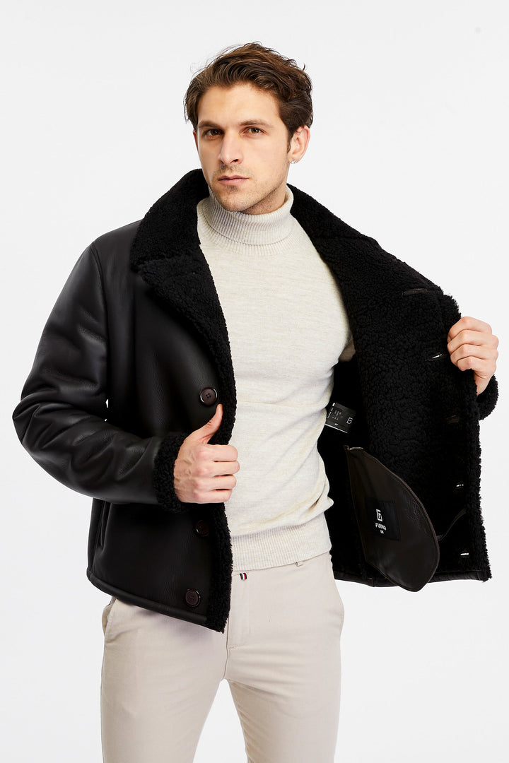 Man wearing black shearling jacket