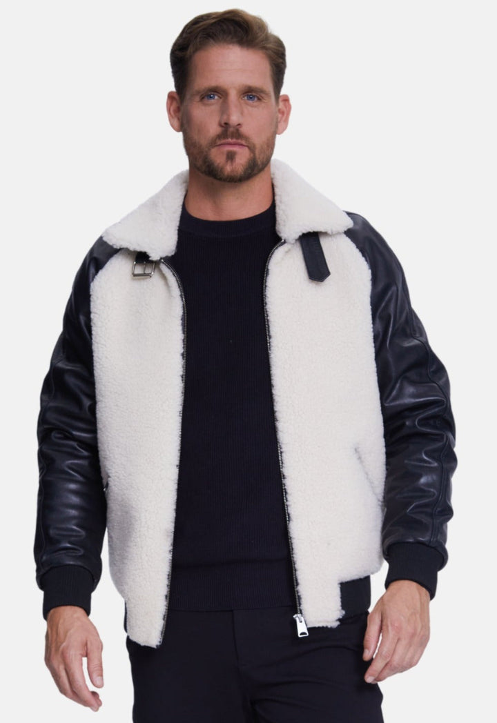 Man wearing black & white sheepskin jacket