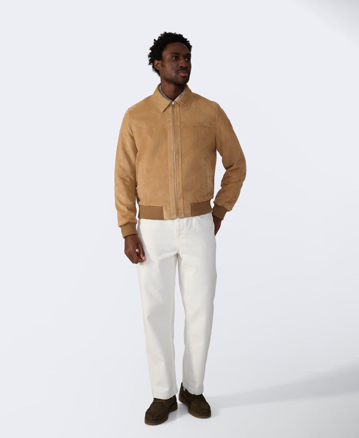 Tan suede bomber jacket on model