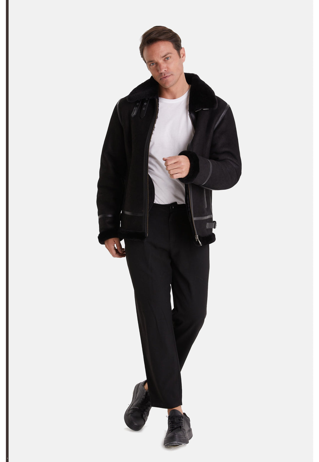 Male model wearing black sheepskin aviator jacket