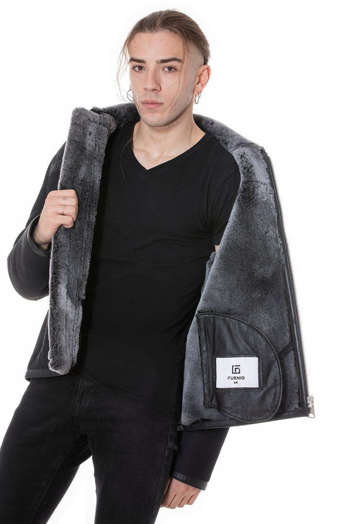 Man wearing black sheepskin jacket open